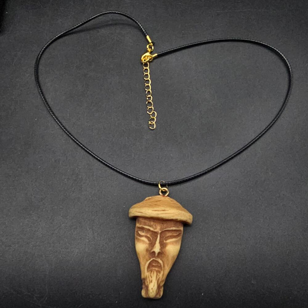 Carved Asian Monk Face Amulet Pendant Necklace on Black Cord